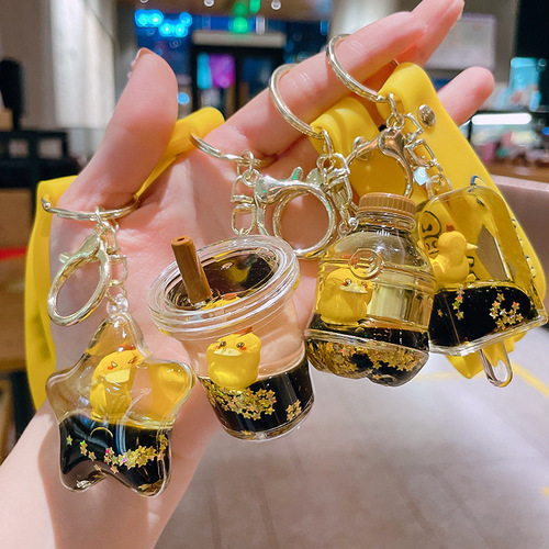 Internet celebrity Kodak Duck key chain filled with oil floating cartoon doll key chain quicksand bottle pendant exquisite gift wholesale