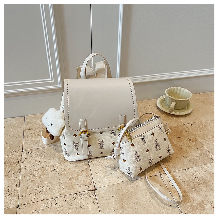 This is a niche design for women, featuring cartoon animal prints. It is a pink backpack with a high level of appearance and large capacity for travel undefined