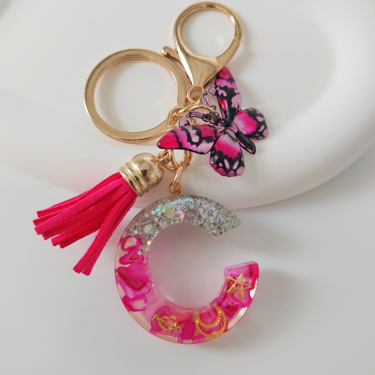 Inventario transfronterizo nueva resina bicolor mariposa borda llavero colgante estrella luna accesorios de joyas