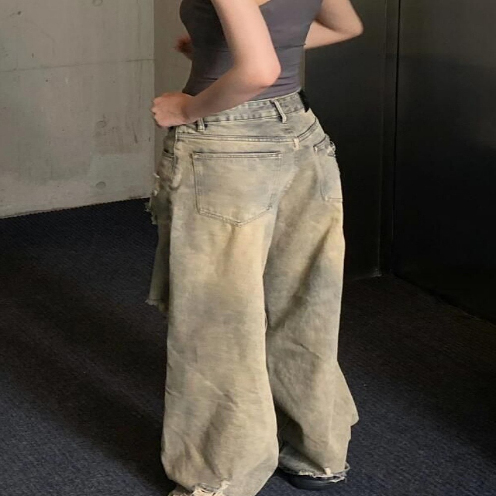 Large American wasteland style distressed washed high street ripped jeans with loose wide leg design for both and_voghion.com