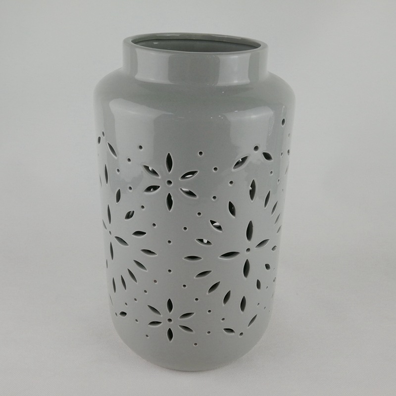 Moderno y simple cerámica nórdica LED linterna hueca vela candelabro decoración interior ligero de lujo lámpara de viento