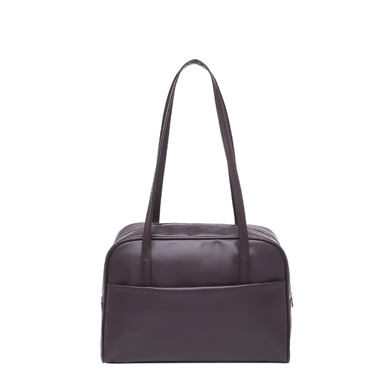 Bolso de hombro coreano de gran capacidad para mujeres 2025 primavera nuevo bolso de brazo retro estilo extranjero bolso de viento minimalista