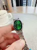 Серебристый, зелёный циферблат