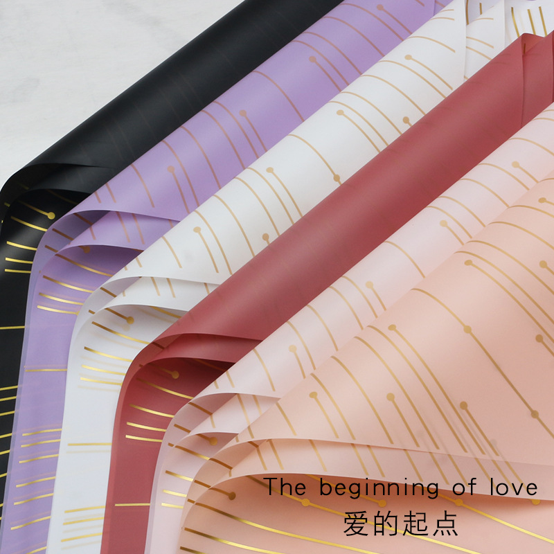 Huaxi transfronterizo amor punto de partida de papel de embalaje de flores Hansu impresión de hilo de oro impermeable papel de niebla florista al por mayor