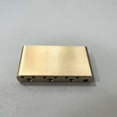 Guitar bridge with pure copper, brass base, and stainless steel base