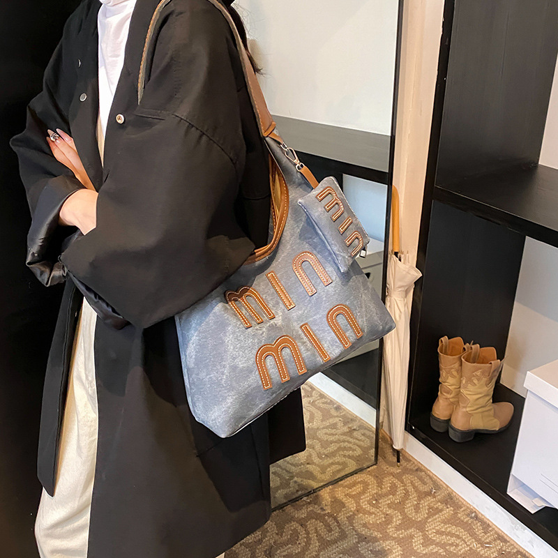 Alta sensación retro de gran capacidad 2024 nuevo estilo coreano bolso de mano de mujer de hombro de moda de viaje bolso de brazo