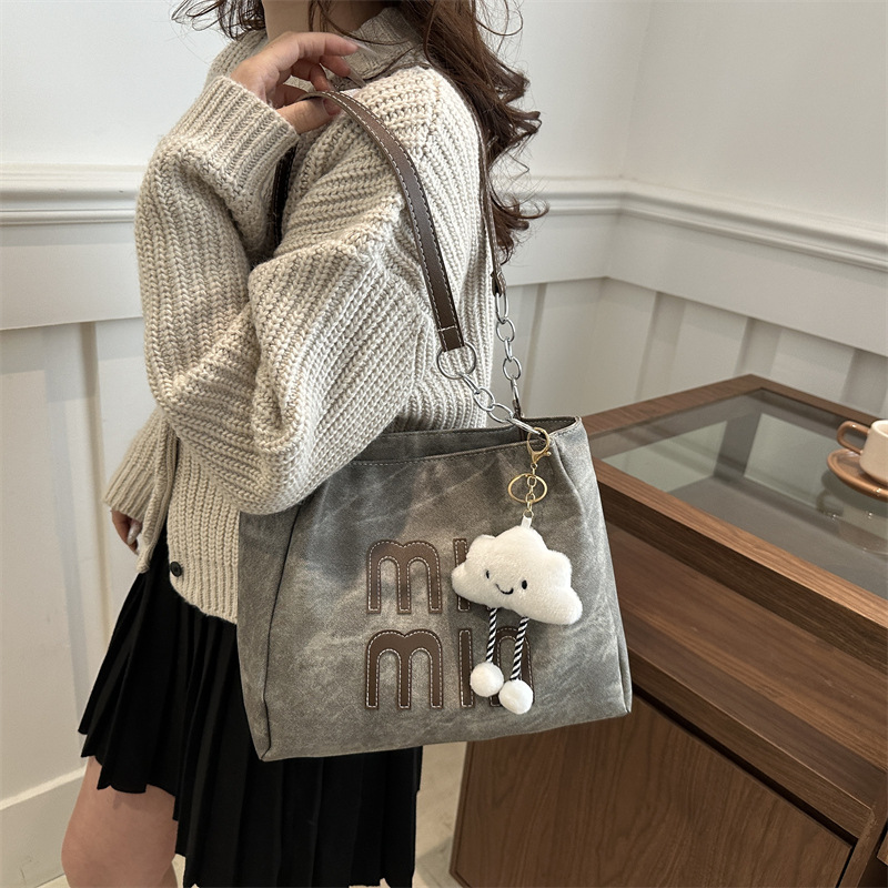 Este año, la versión coreana retro popular bolso de brazo para mujeres 2024 nueva moda bolso de mano casual personalidad textura bolso especial