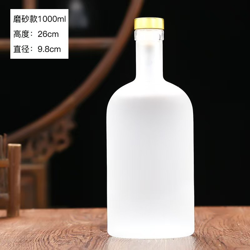 Botella de vidrio de vodka de alta calidad botella de vino de fruta cristal transparente de arena blanca dividida botella vacía con película de retracción térmica en stock