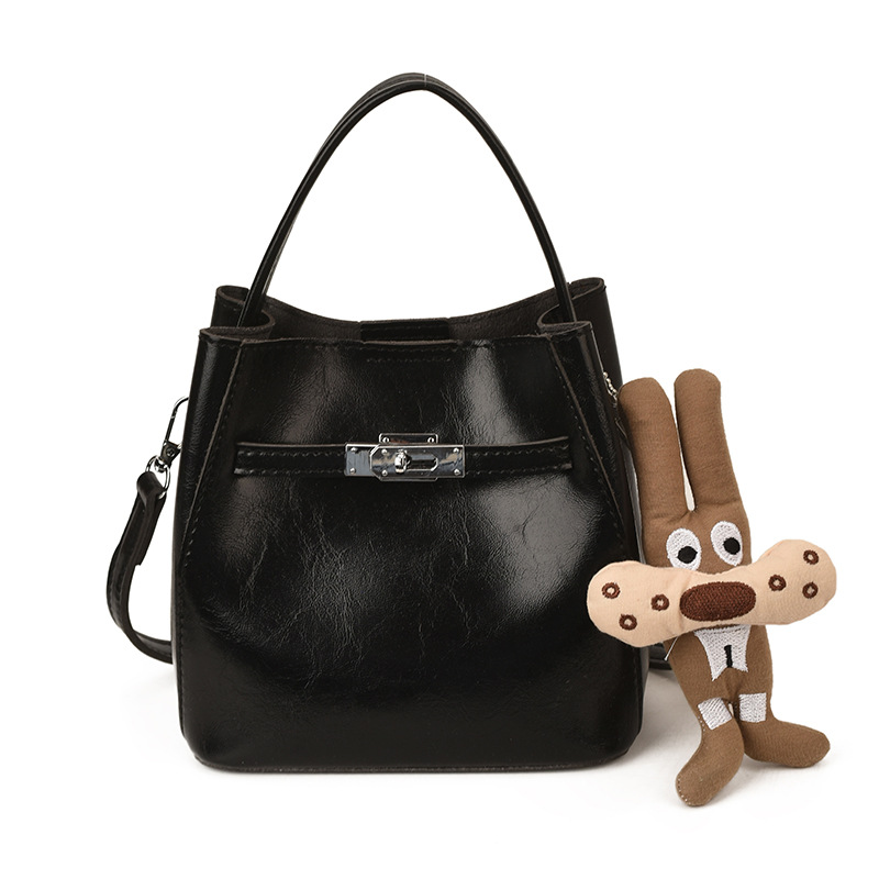 Bolso de viaje bolso de cubo de mano mujer 2025 nuevo otoño invierno alto sentido retro bolso de hombro relajado bolso de mochila