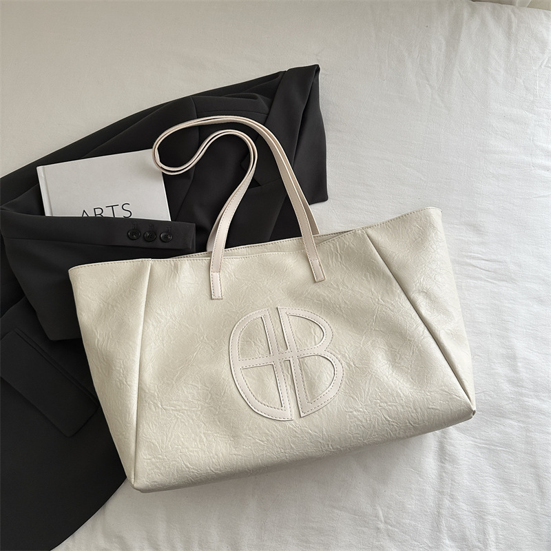 Bolso de mano de dama de alto nivel primavera y verano 2025 versátil bolso de viaje en bolsa popular de gran capacidad este año