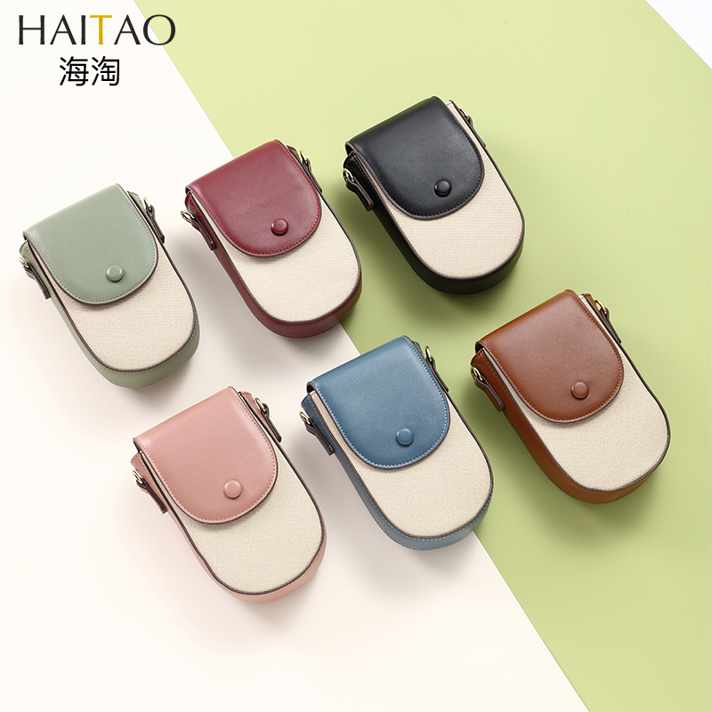 Bolso bandolera Mujer Versión coreana de la moda patrón de lona Versión vertical de la bolsa de teléfono móvil con múltiples tarjetas Versión coreana simple Bolso diagonal de un solo hombro al por mayor