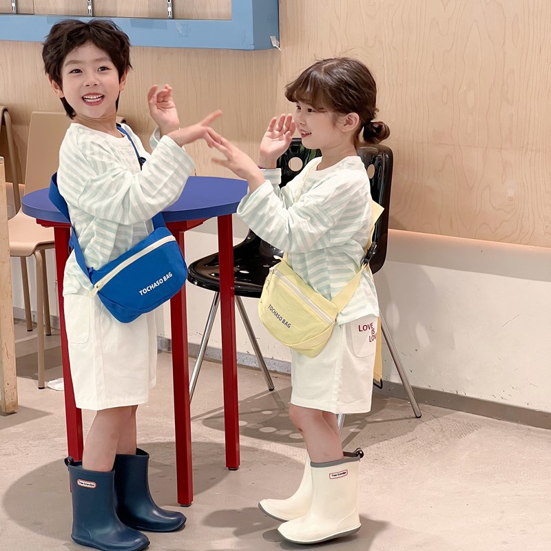 Moda coreana popular para niños y niñas bolsas de cintura letras extranjeras bolsas de mochila para bebés 2026 nuevo bolso de cambio para niños