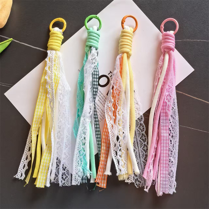 Accesorios de éxito en línea de teléfono móvil cordón de encaje de viento de dopamina accesorios bolsos llaveros colgantes al por mayor image 4