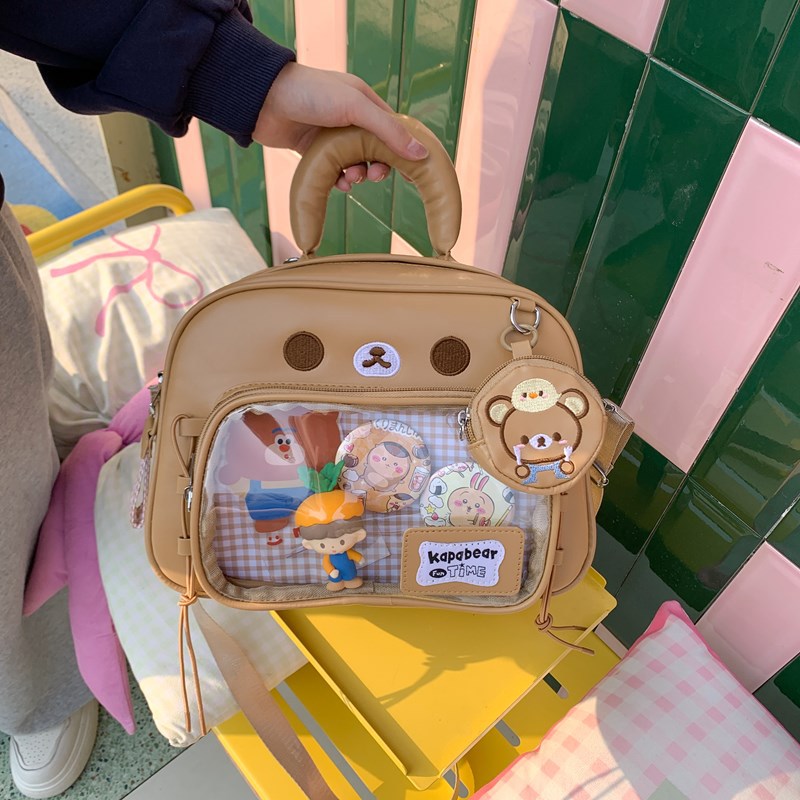 고급스러운 브라운 곰돌이 PVC 백팩, 패셔너블한 틈새 디자인 가방, 여성용 만화 캐릭터 투명 대용량 이트백