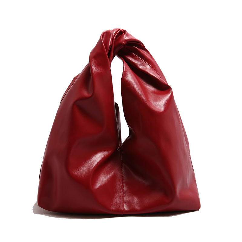 Diseño de nicho, bolso de mano de alta gama, primavera y verano, nueva moda, todo fósforo, simple, color sólido, bolso de mano casual, mujer