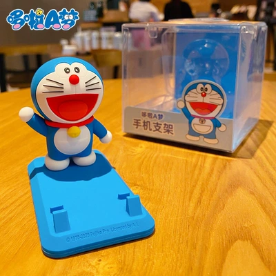 Creative genuine authorized Doraemon mobile phone holder desktop decoration lazy bracket car home decoration accessories wholesale (Car ornaments) - boxed-genuine-doraemon-mobile-phone-holder-happy