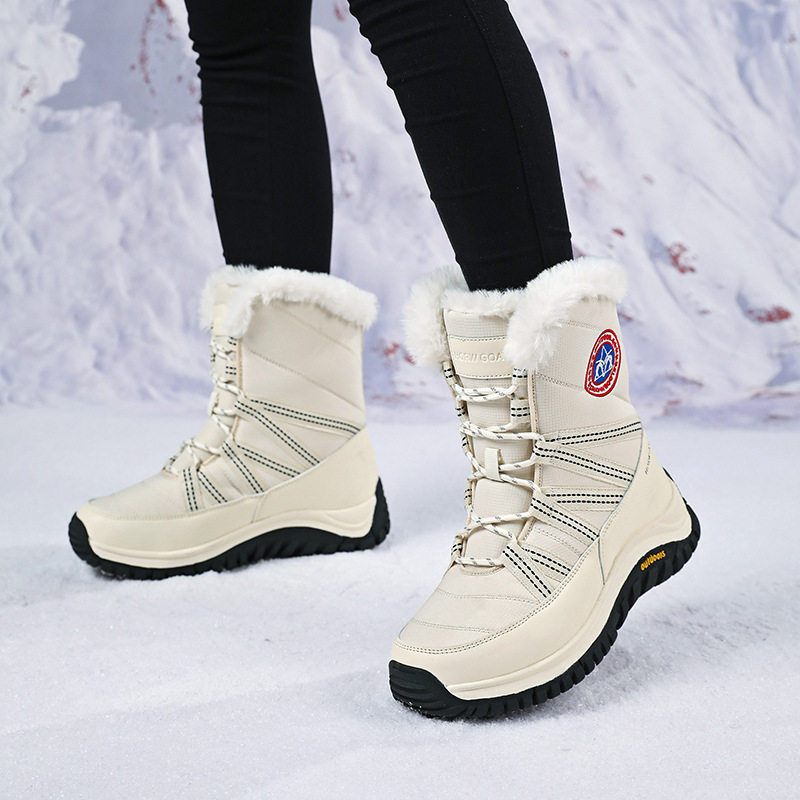 Fabricantes al por mayor botas de nieve impermeables antideslizantes para mujeres, calentamiento de algodón de alta calidad, botas de mujer Kayle Stone