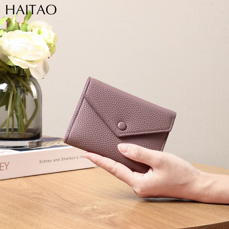 Cartera de mujer corta simple cartera plegable de tres pliegues japonesa y coreana de moda nuevo sobre bolso de cambio transfronterizo