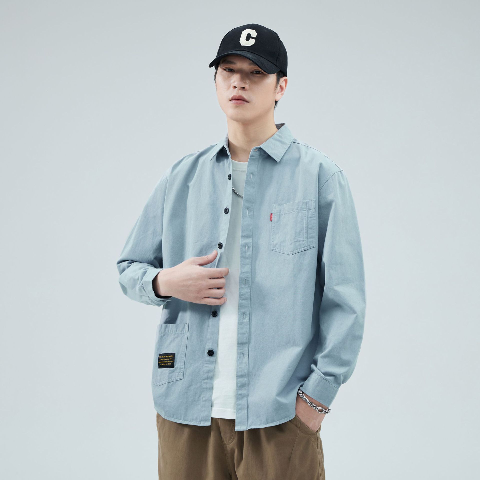 Camisas personalizadas de fábrica para hombres primavera y verano algodón de manga larga tendencia de ropa de estilo americano con solapa de bolsas de moda de ropa de estilo