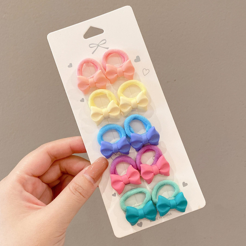 Los niños de la banda del pelo del bebé de la historieta no lastiman la banda de goma del pelo de la niña volumen del pelo menos cuerda del pelo del bebé