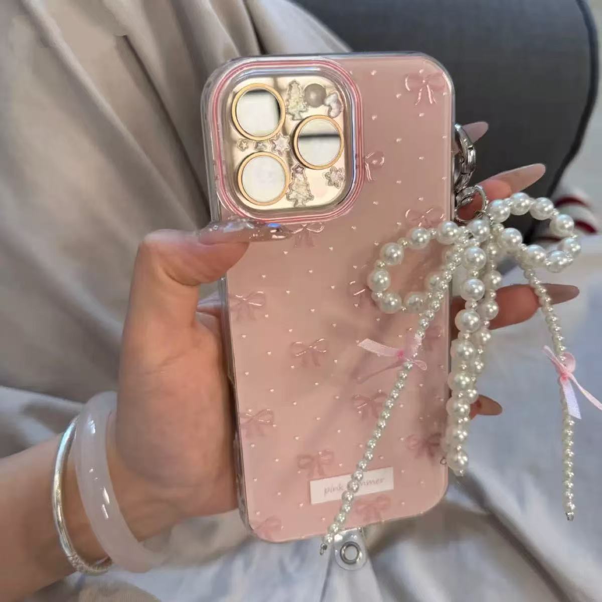 Chica coreana con lazo de lunares para iPhone16ProMax/15 funda para teléfono móvil 13 cadena Apple 14