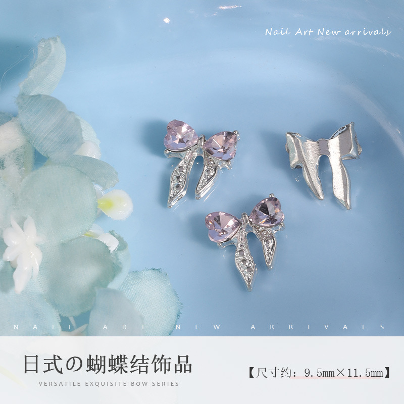 ネットの赤い合金の蝶結びのネイルアクセサリーの高級な金属の立体の蝶ネクタイの爪の装飾の部品の卸売り|undefined