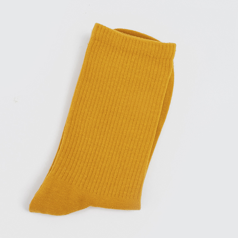 Calcetines de mujer para primavera y otoño, calcetines de algodón de color liso, versátiles y a la moda, calcetines holgados, calcetines de longitud media, calcetines deportivos que absorben el sudor, venta al por mayor.