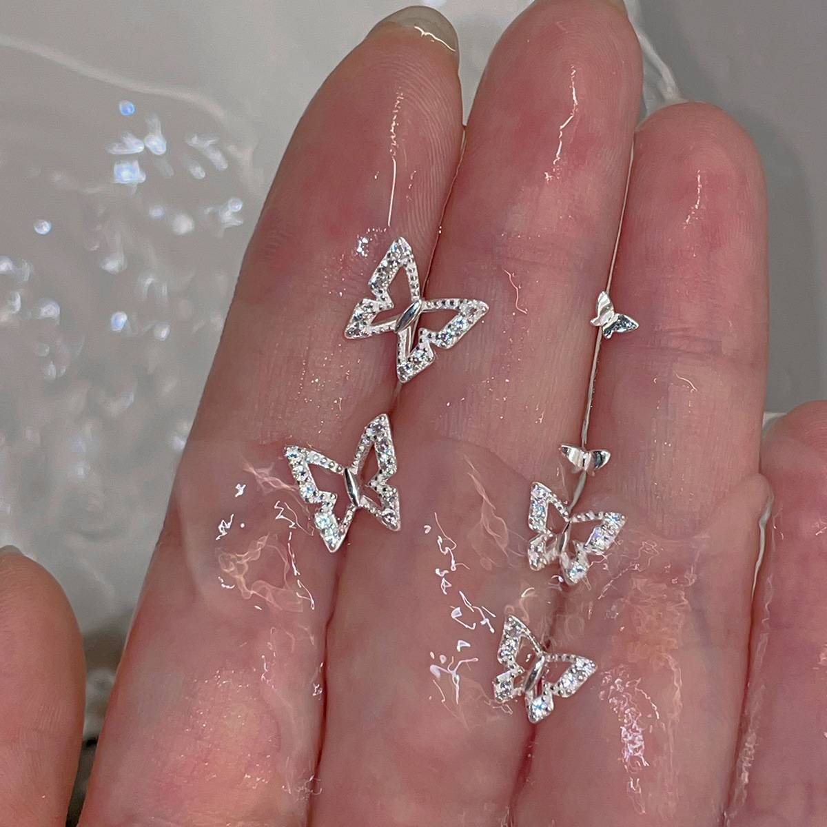 999足銀鏤空蝴蝶耳釘女仙氣森系小眾設計鋯石耳骨釘新款氣質耳飾