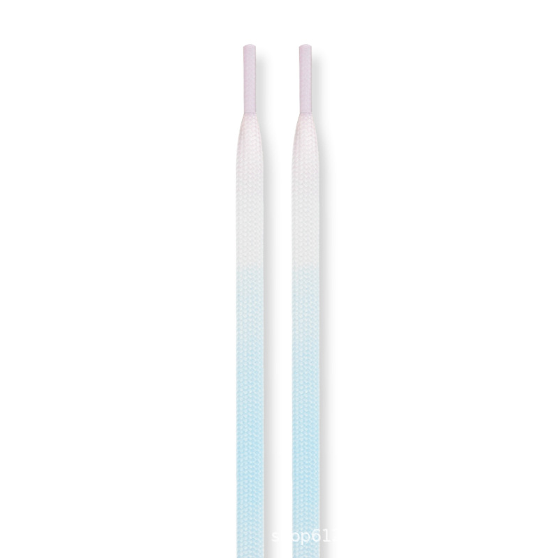 A pair of blue, white and pink gradient color shoelaces