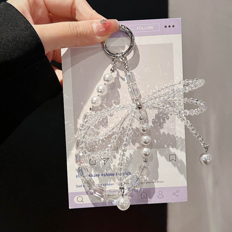 Boutique hecho a mano de alta gama para teléfono móvil cadena corta ins perla mariposa cordón de teléfono móvil de moda colgante de mensajero corto