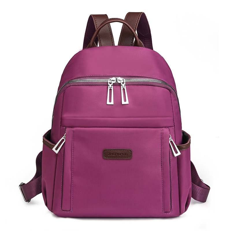 Venta al por mayor transfronteriza 2024 invierno nuevo estilo casual damas mochila de nailon simple y versátil mochila de viaje ligera marea