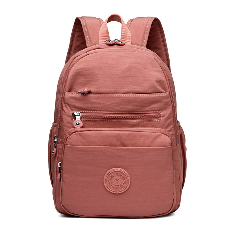 Mochila de hombro de comercio exterior 2025, nueva mochila de computadora simple de color sólido, mochila de escuela secundaria, mochila para hombres y mujeres.
