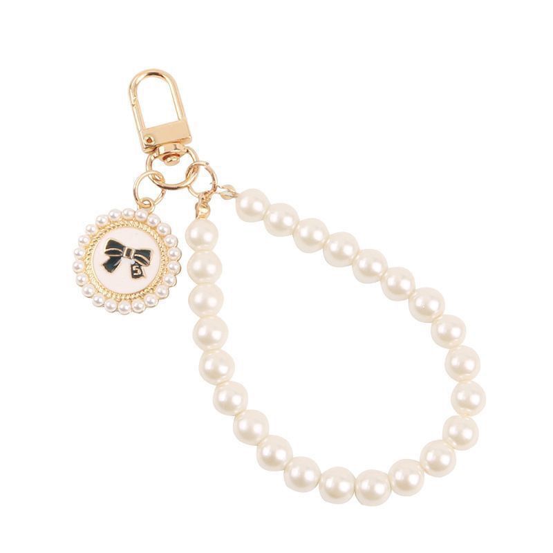 Cadena de perlas caja de teléfono móvil pequeña cadena de viento de fragancia nueva pulsera corta muñeca delicada colgante de mujer portátil