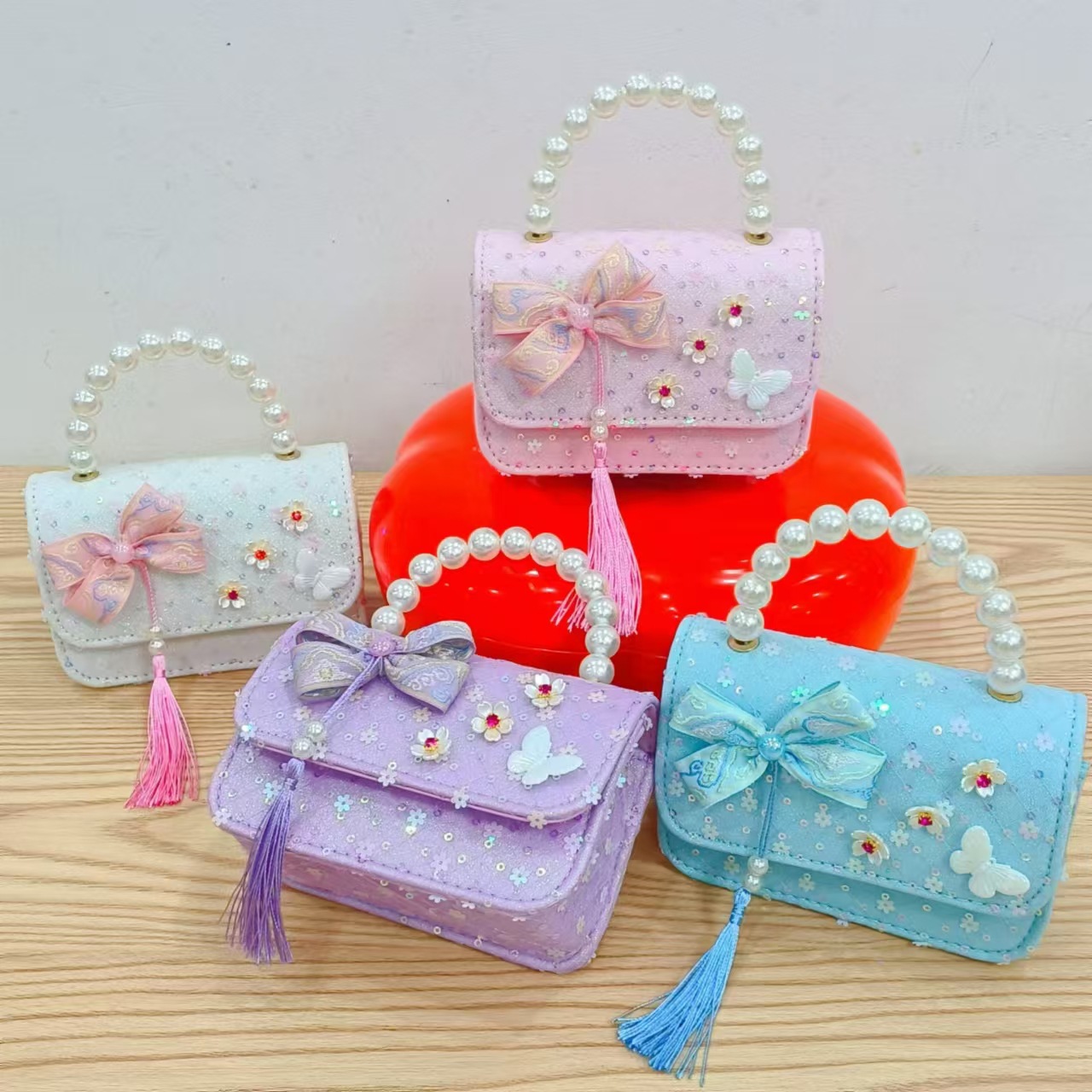 Niños pequeños viento fragrante hombro alto sentido de la chica antigua bolso de cambio princesa perla accesorios de ropa china portátil mochila