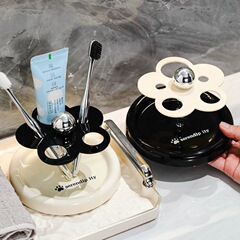 軽くて豪華な陶磁器の歯ブラシホルダーのトイレの洗面台の電動歯ブラシの歯磨き粉の棚の眉毛の筆の化粧ブラシの収納棚