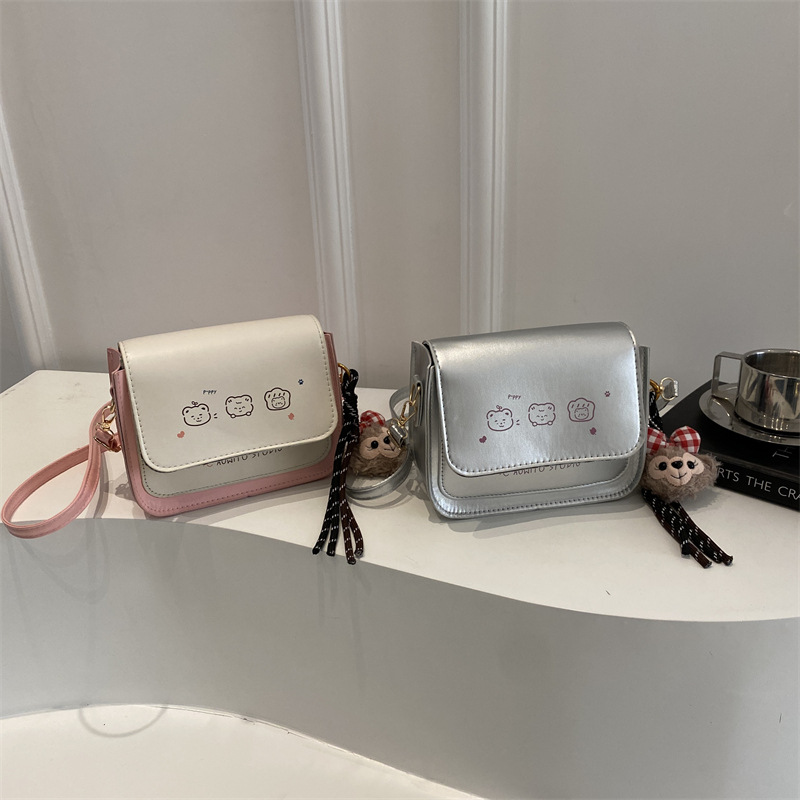 Bolso de mujer de color contrastante 2025 nuevo estilo de estilo de impresión de moda extranjera, bolso de hombro simple, bolso de mochila dulce