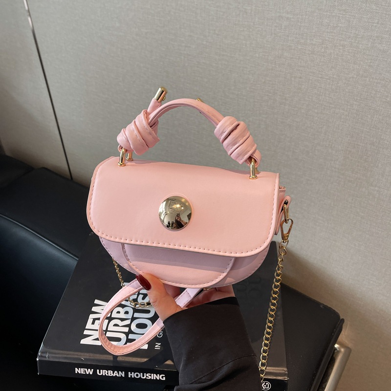 Moda popular de este año textura empalme mini ins hebilla bolsa pequeña 2025 primavera nueva bolsa de sillín de estilo occidental