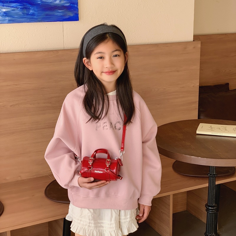 Coreano simple color sólido bolsas de hombro para niños y niñas bolsas de cilindro mini compactas para bebés bolsas de almohada para niños de comercio exterior transfronterizo