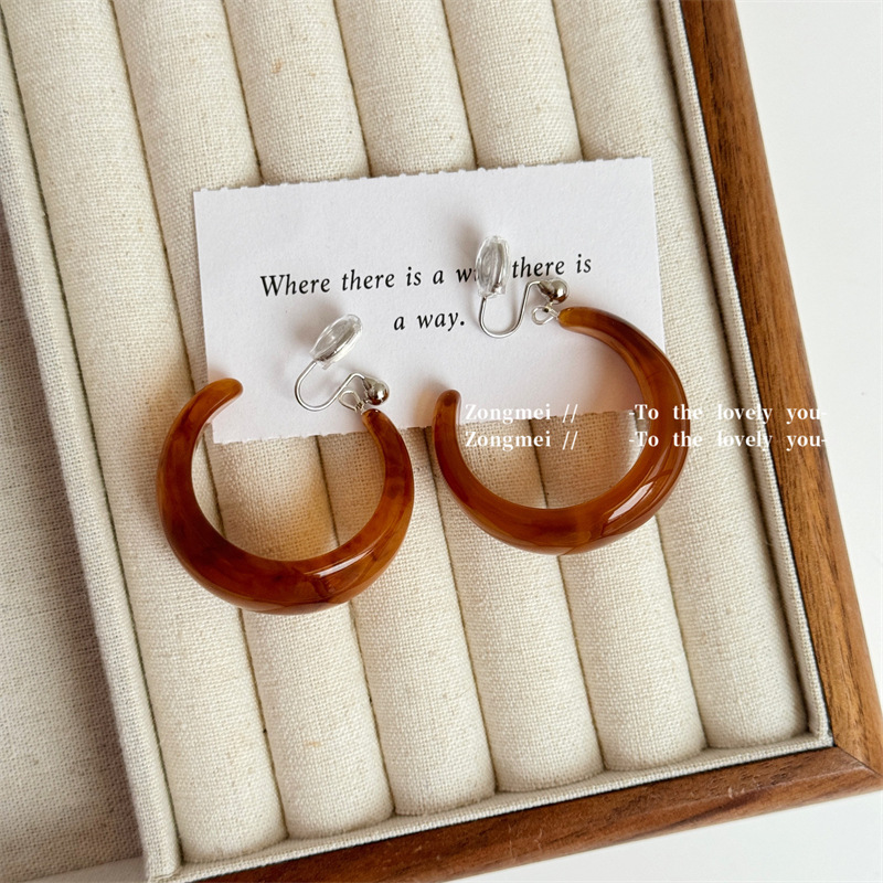 A pair of coffee-colored mosquito repellent coils