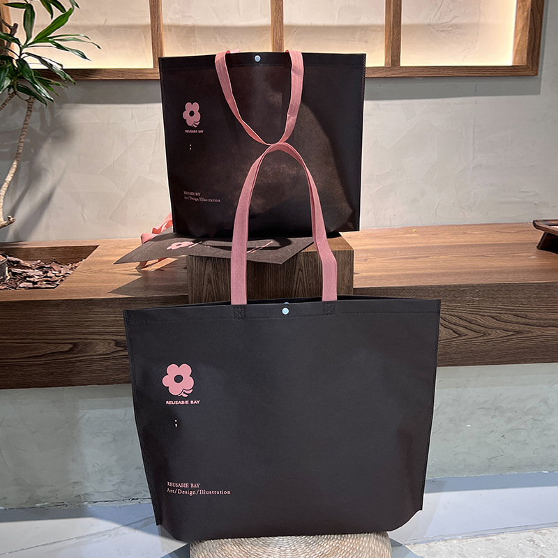 Bolso de mano no tejido de gran capacidad personalizado LOGO engrosado ropa de mujer protección ambiental bolsa de publicidad bolsa de compras de la tienda de ropa