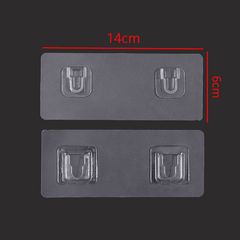 Wall-mounted dual-port plug holder with invisible adhesive hooks for power strip mounting