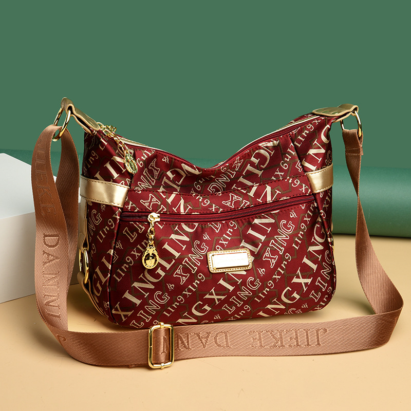 Bolsa de mujer 2023 nueva bolsa de mensajero de hombro de tela Oxford impermeable bolsa de Madre de mujer de mediana edad de gran capacidad multicompartimento