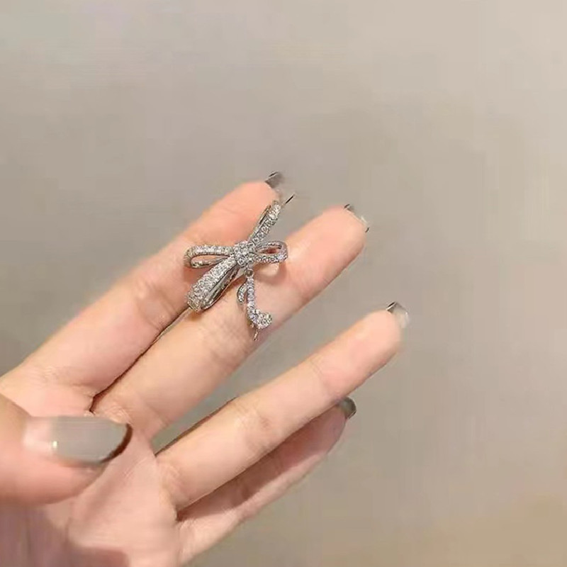 S925 Corea del Sur Luz de lujo completo diamante bowknot nota nicho diseño sentido earless oreja pendientes clip [un paquete]