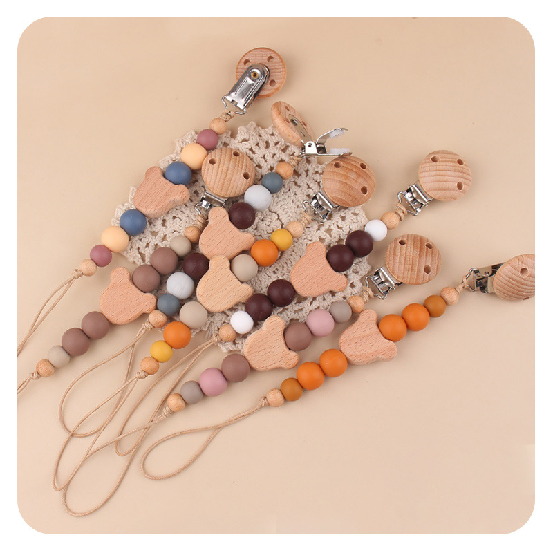 Productos para bebés y niños abrazadera de chupeta creativa caricatura bebé oso cabeza de beech mordida cadena de chupeta de dientes molares anti-caída cadena