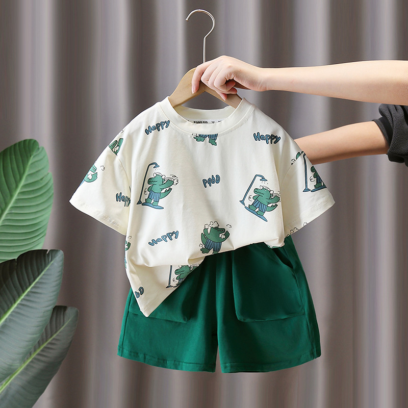 7947 Traje de manga corta para niños 2025 Nuevo verano Camiseta con estampado de dinosaurios de dibujos animados para niños Ropa de moda de verano