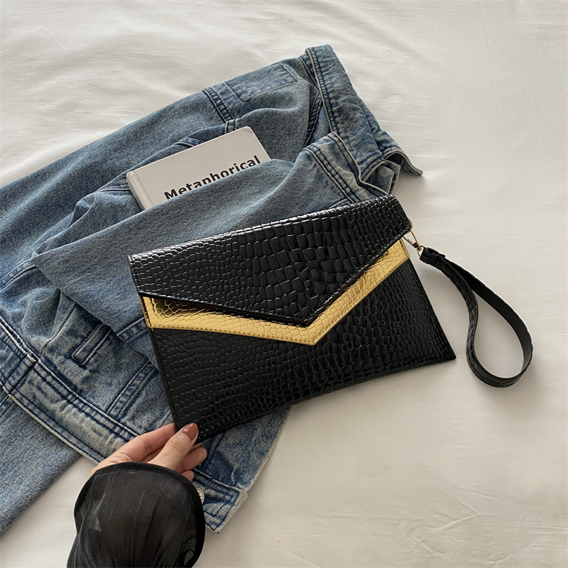 Bolso de mano sobre 2024 otoño nuevo estilo personalidad coreana moda femenina de moda temperamento casual todo-fósforo banquete pequeño bolso