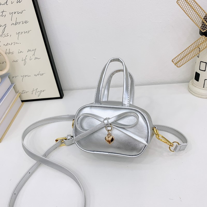 Coreano simple color sólido bolso de hombro para niños y niñas mini bolso de bebé lindo dulce bolso de arco para niños