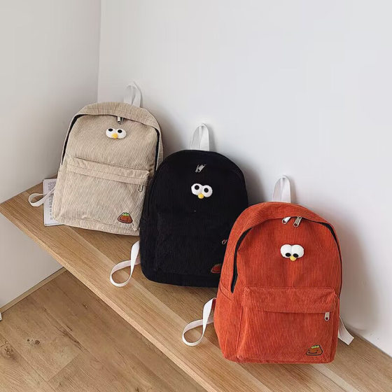 Factory in stock simple lightweight corduroy backpack cute primary school student schoolbag men's and women's large capacity casual backpack