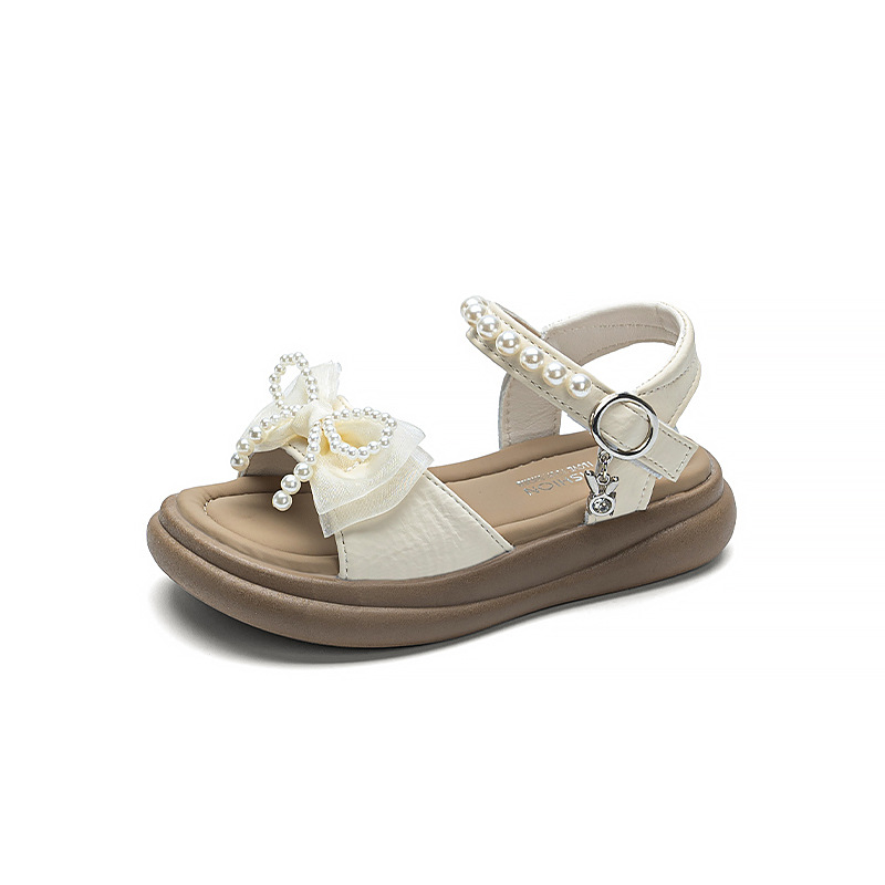 Zapatos de arco de niñas 2026 verano nuevos zapatos de princesa de estilo extranjero zapatos de moda para niñas zapatos de soleas suaves zapatos de soja