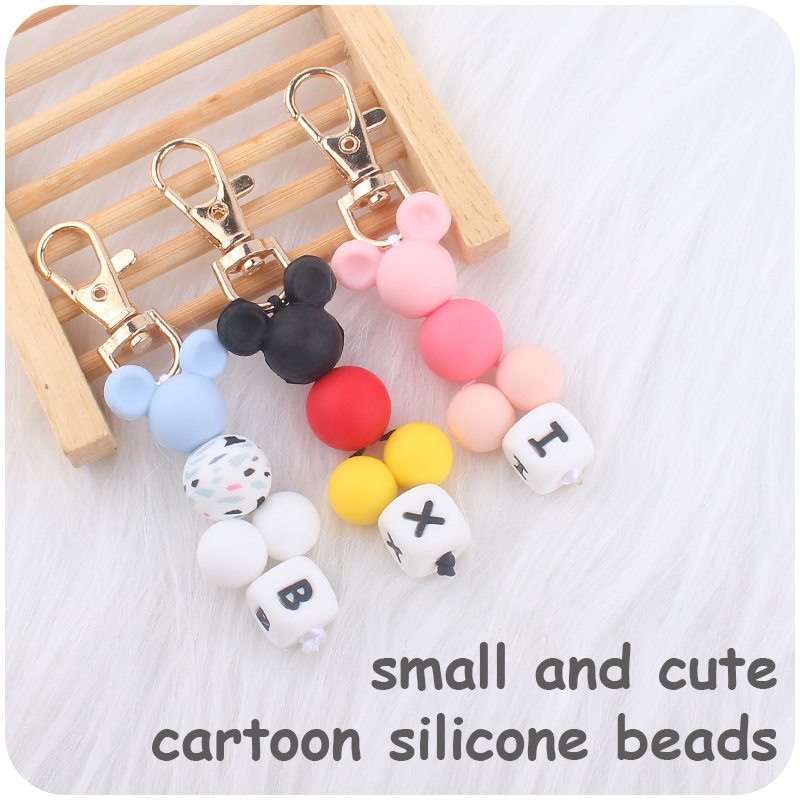 Creativo DIY nueva historieta cuentas pequeño colgante contraste color silicona cuentas llavero colgante bolsa pequeño colgante AliExpress